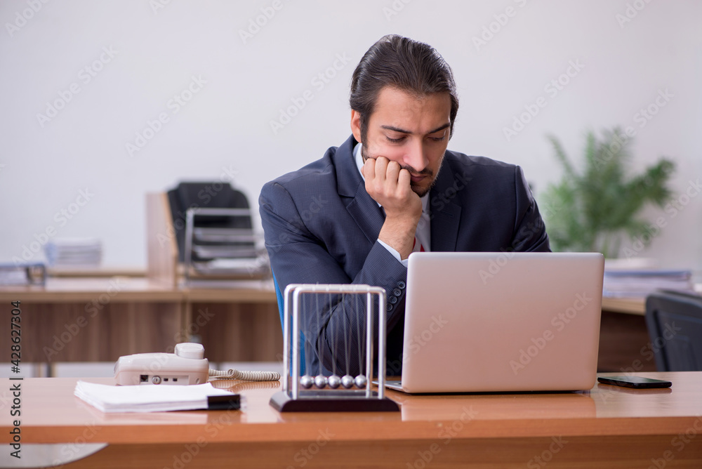Young man businessman employee sitting in the office Young man businessman employee sitting in the office