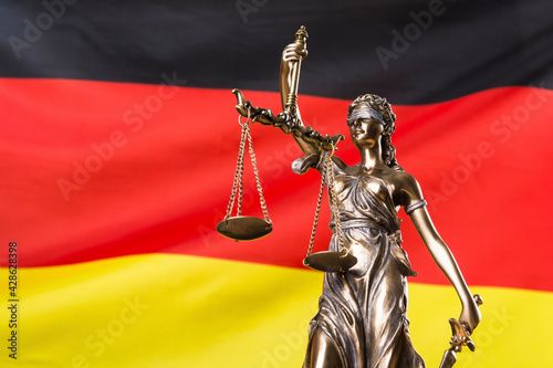 Lady justice against German flag