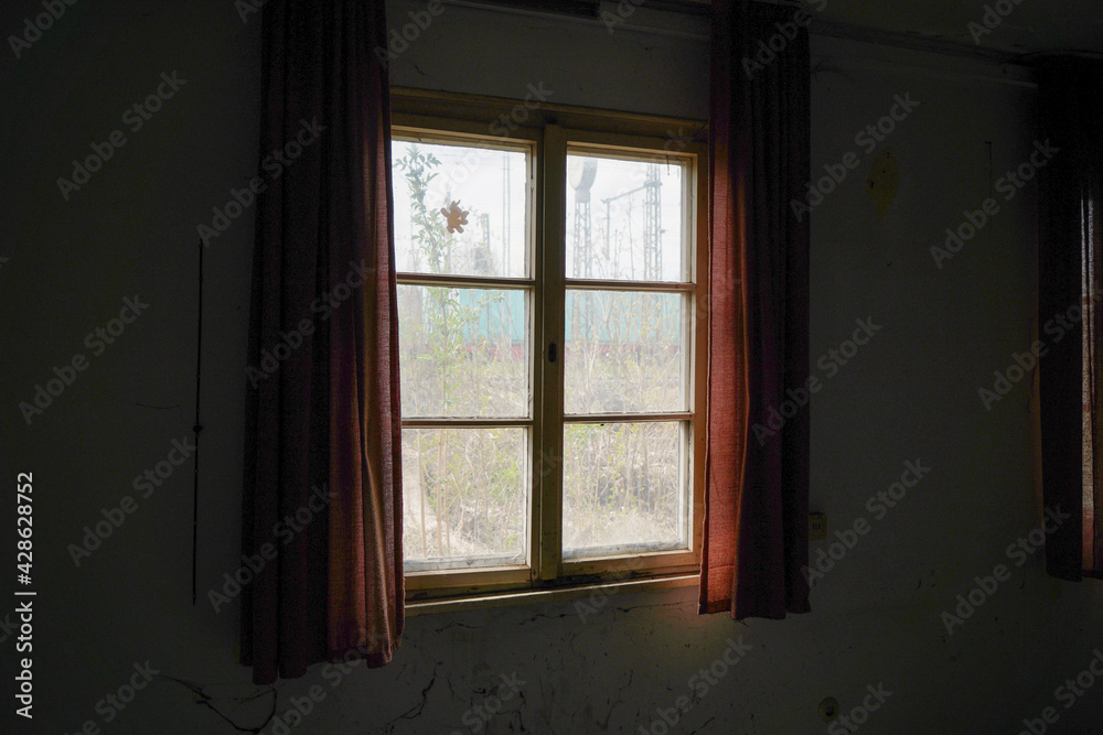 Old wooden frame and broken glass window on an old building for renovation Old wooden frame and broken glass window on an old building for renovation
