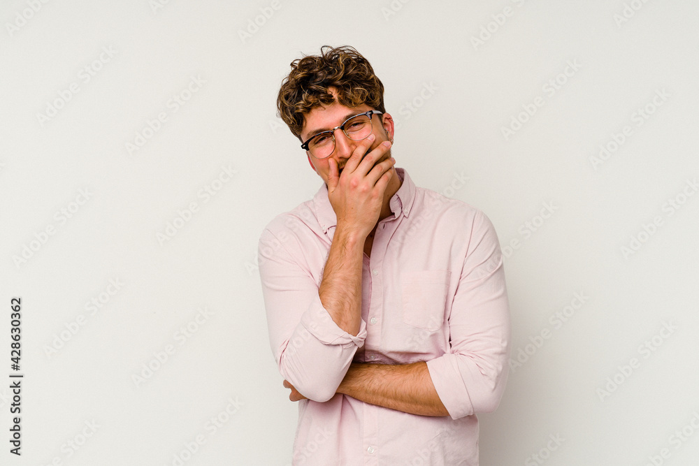 Young caucasian man isolated on white background laughing happy, carefree, natural emotion. Young caucasian man isolated on white background laughing happy, carefree, natural emotion.