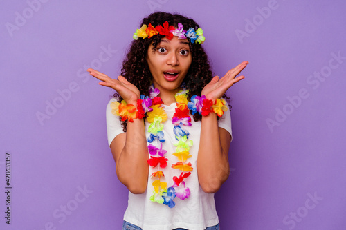 Young Hawaiian woman isolated on purple background surprised and shocked.