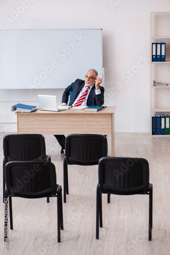 Old male business couch in the classroom during pandemic