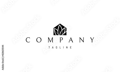 Vector logo on which an abstract image of a house with a silhouette of leaves inside.