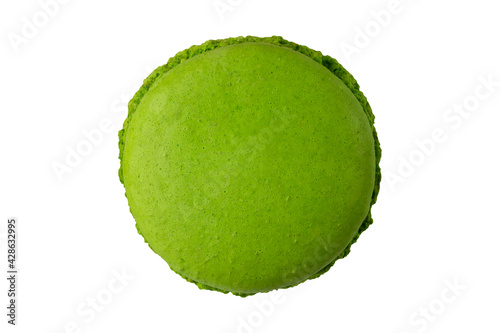 One green macaron cookie isolated on a white background.