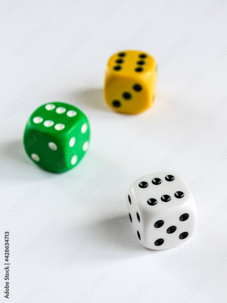 Three colorful dices isolated on white background Three colorful dices isolated on white background