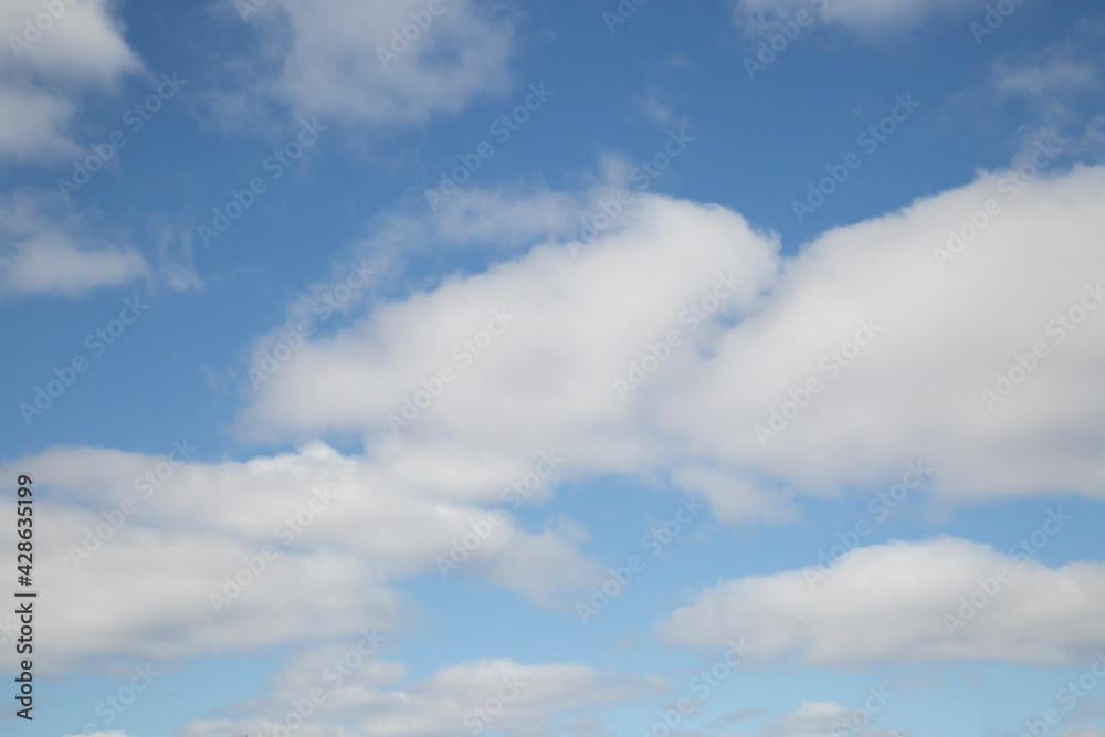 Blue sky background with clouds.Spring landscape. Blue sky background with clouds.Spring landscape.