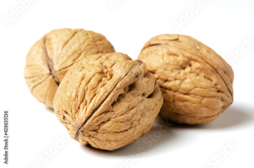 Walnuts on a white background. Nut - a source of vitamins and useful trace elements. Close up.
