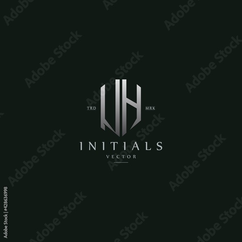 classy UH vintage metal monogram logo. elegant silver initials icon premium vector design template