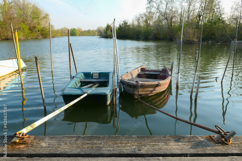 Abandoned rowing boat, isolated on a lake. Two  rowboat on water.