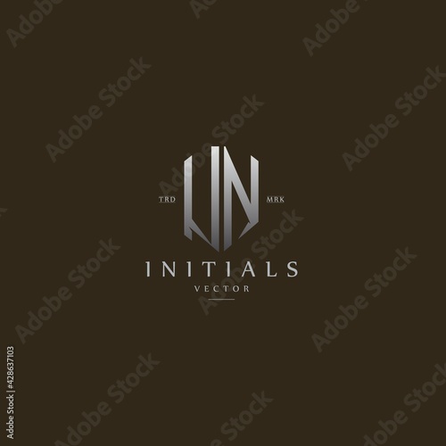 classy UN vintage metal monogram logo. elegant silver initials icon premium vector design template