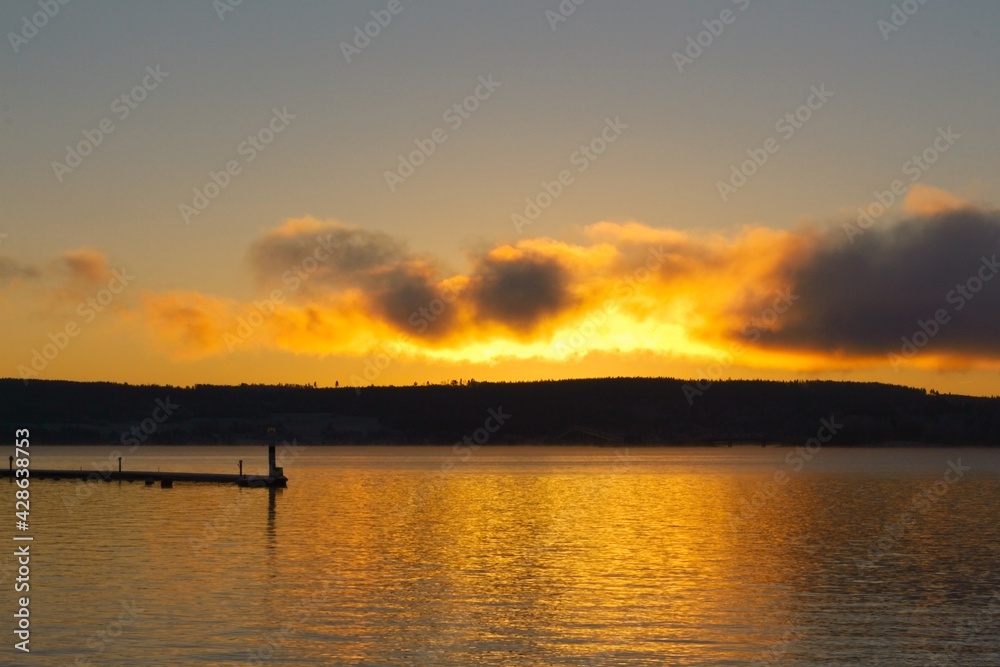 The marina and lighthouse in Östersund in the light of sunset