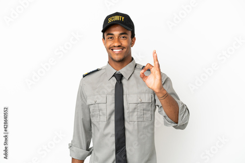 Fotografija African American safeguard over isolated white background showing ok sign with f