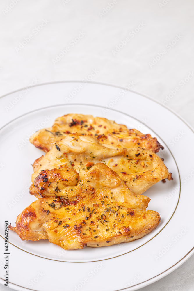 Delicious chicken breasts fried and served on the plate Delicious chicken breasts fried and served on the plate