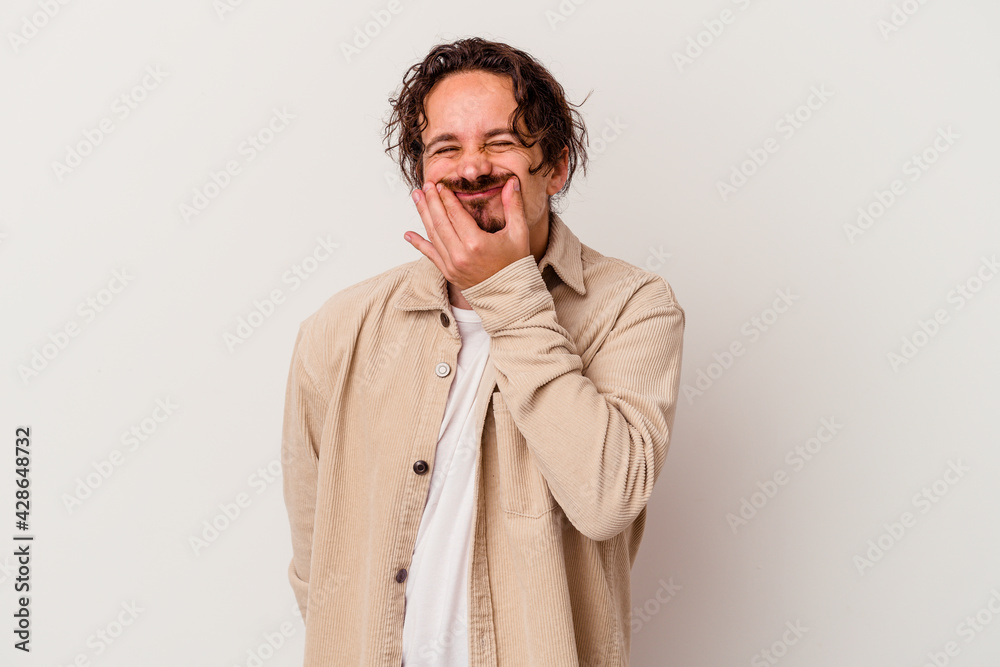 Young caucasian man isolated on white background doubting between two options. Young caucasian man isolated on white background doubting between two options.