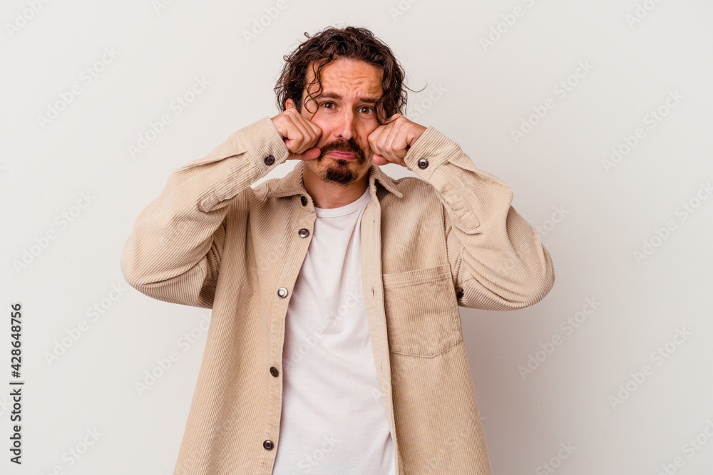 Young caucasian man isolated on white background whining and crying disconsolately. Young caucasian man isolated on white background whining and crying disconsolately.