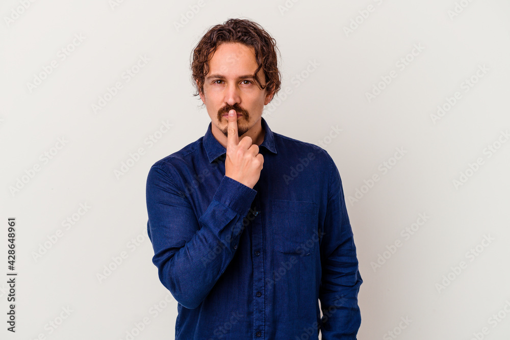 Young caucasian man isolated on white background thinking and looking up, being reflective, contemplating, having a fantasy. Young caucasian man isolated on white background thinking and looking up, being reflective, contemplating, having a fantasy.