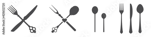 Crossed knives, spoons and forks. Vintage and modern. Vector illustration