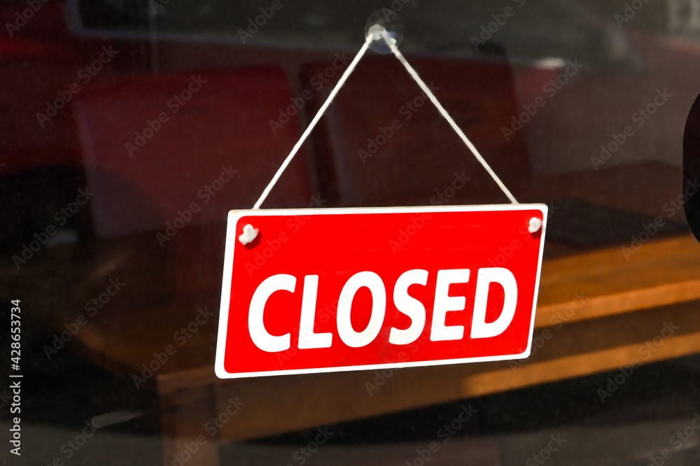 Poster Closed sign in the window of a business which was forced to shut ...