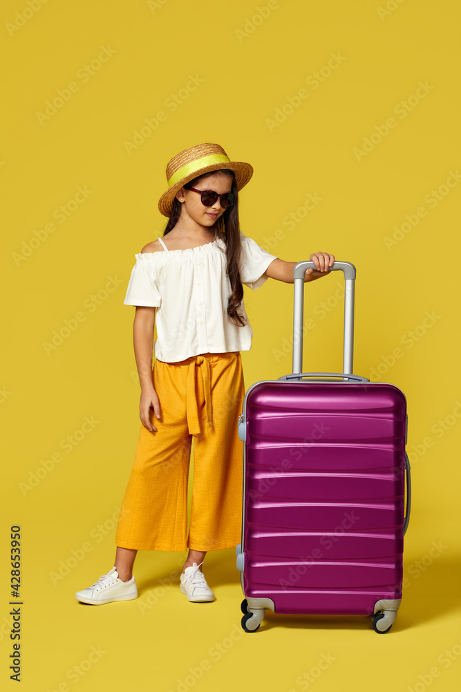 Happy little child girl in hat with pink suitcase Happy little child girl in hat with pink suitcase