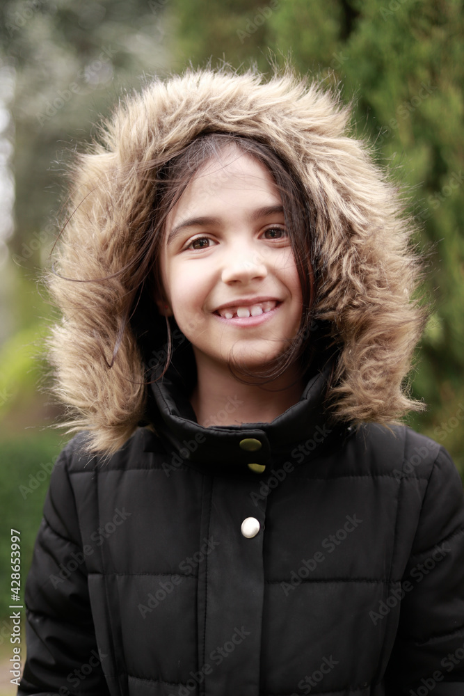portrait of latina girl with coat outdoors portrait of latina girl with coat outdoors