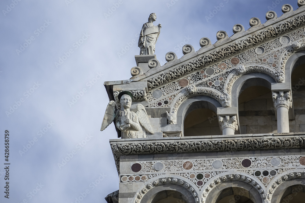 Fototapeta premium Architectural fragments of Romanesque medieval Roman Catholic Pisa Cathedral at Square of Miracles (Piazza dei Miracoli or Piazza del Duomo), UNESCO World Heritage Site. Pisa, Tuscany, Italy.