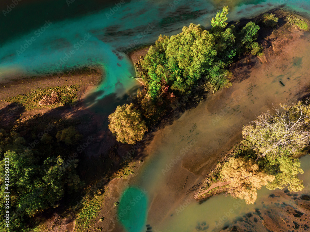 Nature from above. A river with blue water and trees on its bank. Aerial photography Nature from above. A river with blue water and trees on its bank. Aerial photography