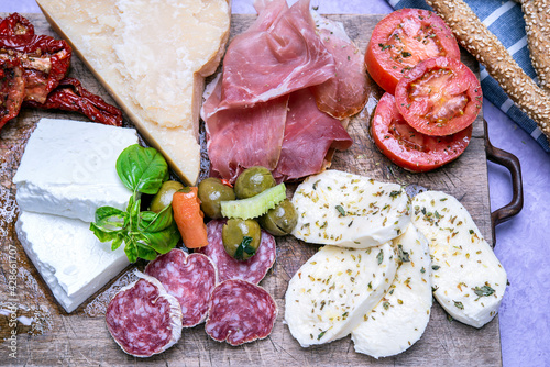 wooden platter of cold cuts and cheese appetizer widely used in Italian restaurants
