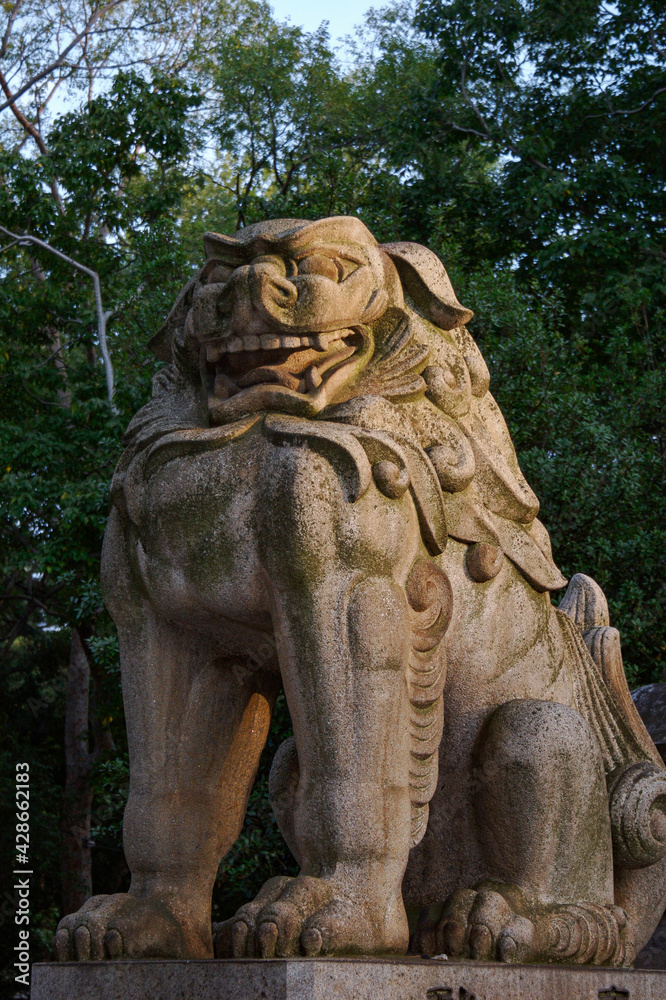 lion statue in front of a temple