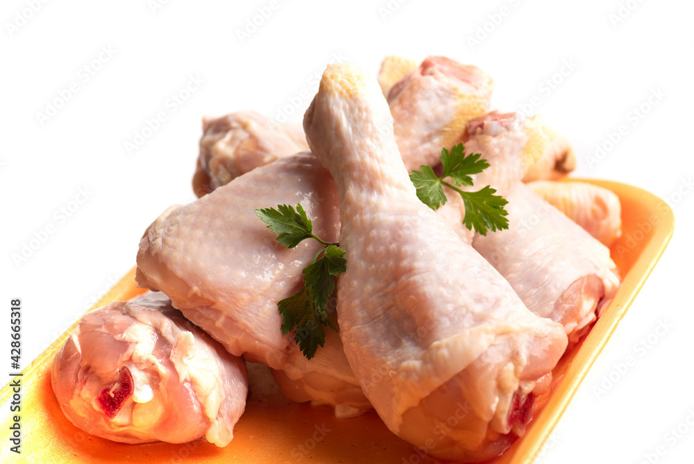 Raw chicken drumsticks with cooking ingredients Raw chicken drumsticks with cooking ingredients