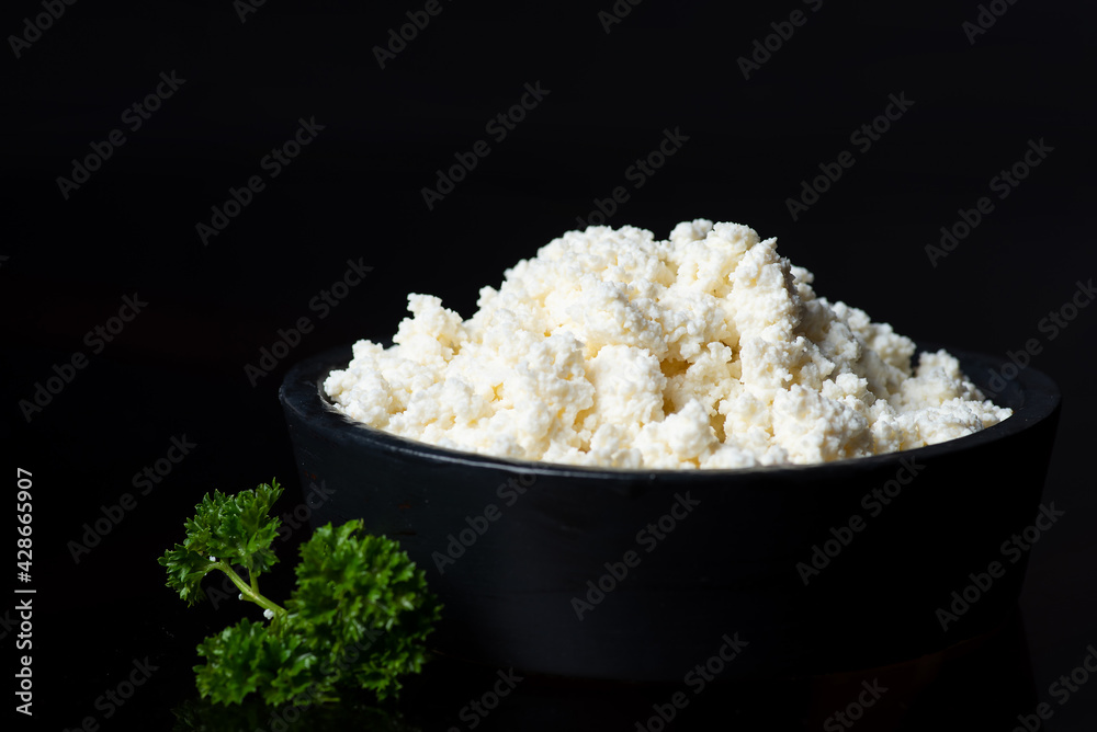 Crumbled cow cheese in a bowl Crumbled cow cheese in a bowl
