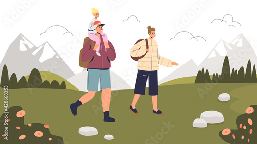 Young family on vacation hiking over mountains background. Parents travel, hike with little son