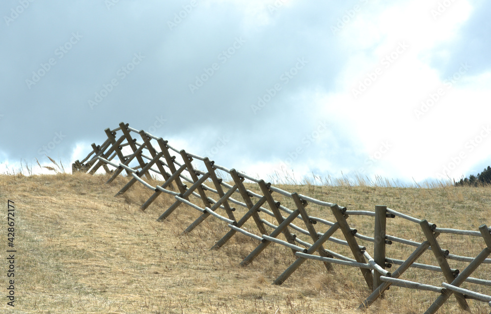 Line of jackleg fencing up a hill Line of jackleg fencing up a hill