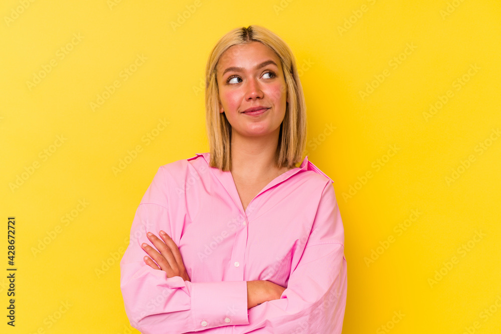 Young venezuelan woman isolated on yellow background dreaming of achieving goals and purposes Young venezuelan woman isolated on yellow background dreaming of achieving goals and purposes