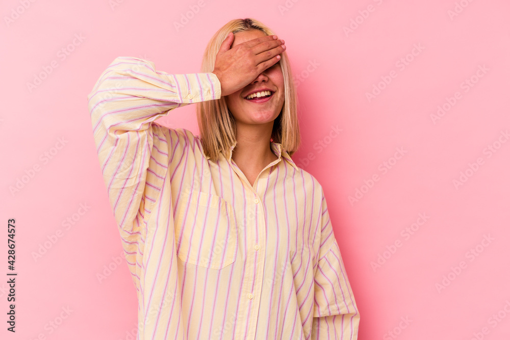 Young venezuelan woman isolated on pink background laughs joyfully keeping hands on head. Happiness concept. Young venezuelan woman isolated on pink background laughs joyfully keeping hands on head. Happiness concept.