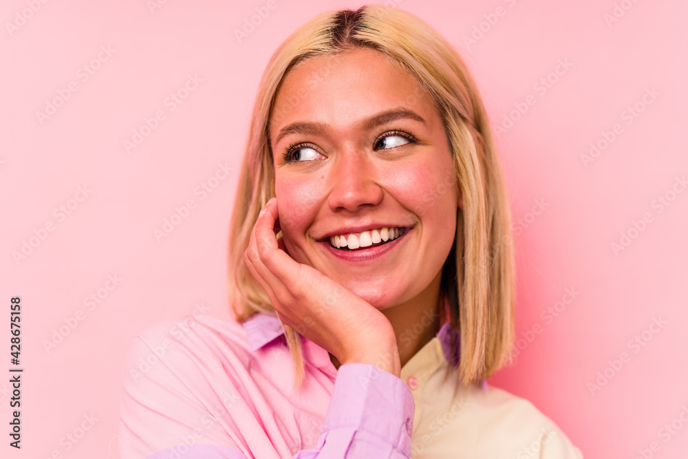 Young caucasian woman face closeup isolated on pink background Young caucasian woman face closeup isolated on pink background