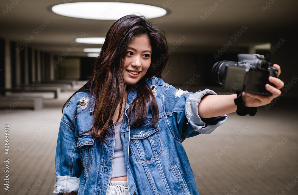 Asian woman vlogging and using camera, social media influencer content creator lifestyle Asian woman vlogging and using camera, social media influencer content creator lifestyle