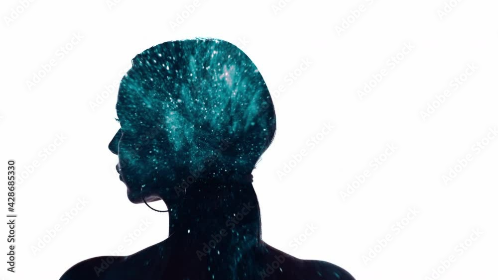 Double exposure portrait. AI technology. Neural network. Blue glitter stardust mist animation in dark back view silhouette of woman turning head isolated on white empty space background.