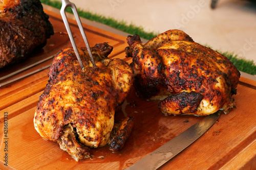 oven roasted whole chicken on a carvery station