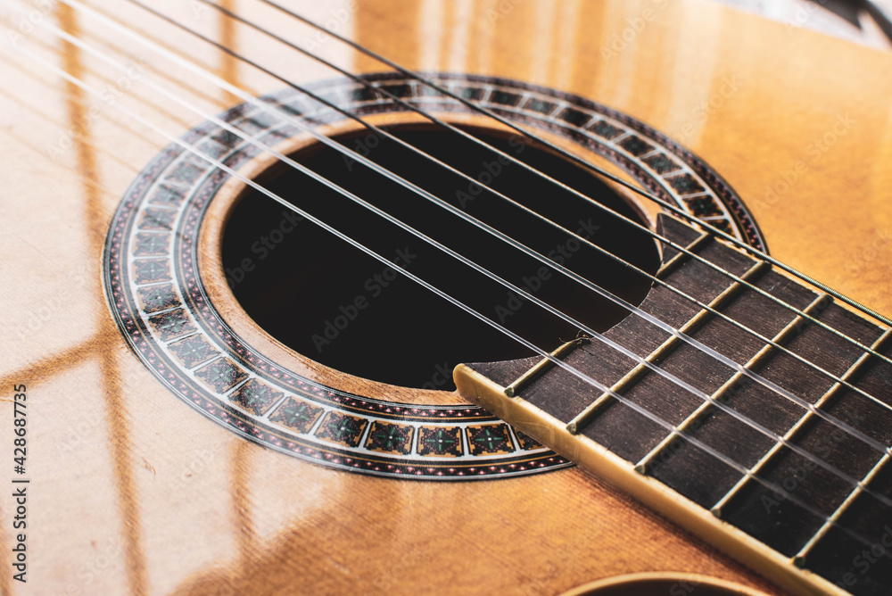 Strings of a guitar, music, guitar sound, acoustic guitar close up Strings of a guitar, music, guitar sound, acoustic guitar close up