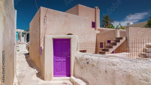 Wallpaper Mural sunny day santorini island fira town street purple door panorama timelapse 4k greece Torontodigital.ca