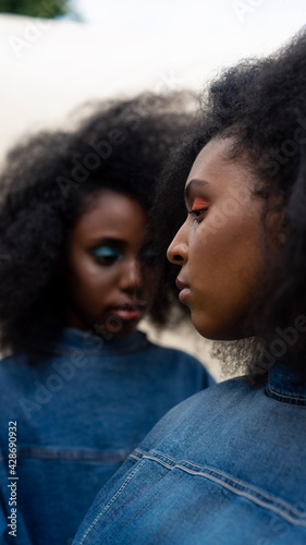 Portrait of sisters with afros