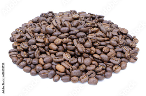 Heap of coffee beans isolalated on a white background. Roasted coffee beans. Seeds of coffee. Top view photo