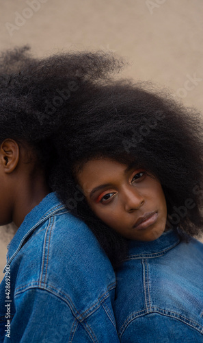 portrait of a beautiful woman wearing denim with striking eyes