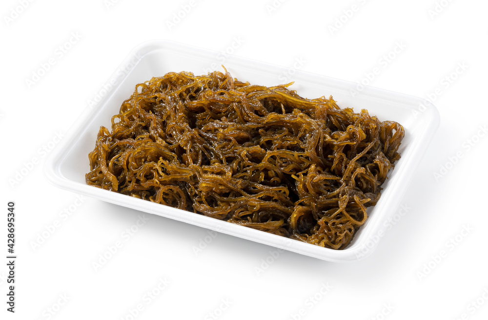Mozuku in a food tray on a white background. Mozuku in a food tray on a white background.