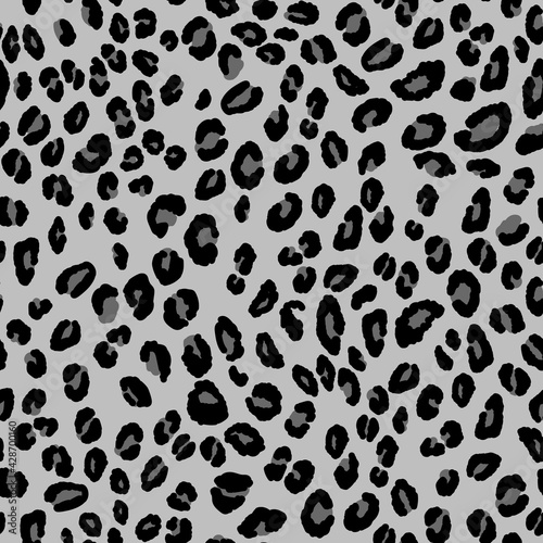 Abstract modern leopard seamless pattern. Animals trendy background. Grey and black decorative vector stock illustration for print, card, postcard, fabric, textile. Modern ornament of stylized skin