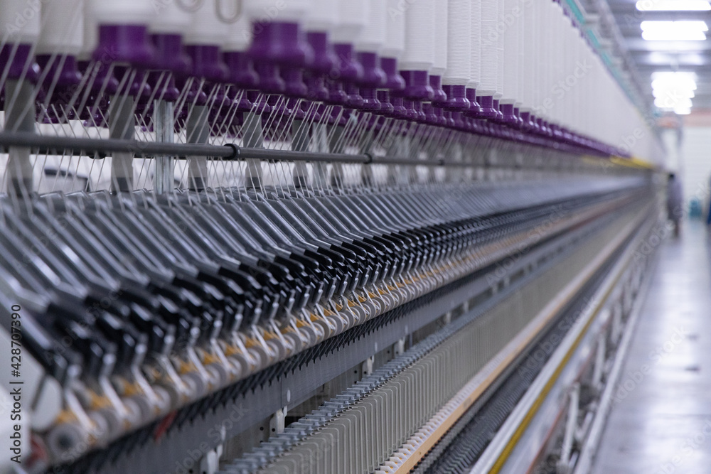 Cotton Yarns in the cotton thread factory where they are rolled into