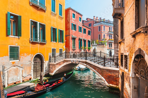 Beautiful canal with old medieval architecture and bridge in Venice, Italy. Famous travel destination