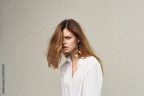 Attractive woman beautiful hair glamor white shirt fashion student light background © SHOTPRIME STUDIO