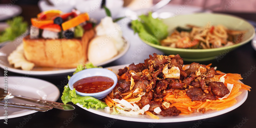 Pork sliced fried with garlic that looks beautiful and looks delicious. Pork sliced fried with garlic that looks beautiful and looks delicious.