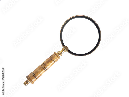 Old vintage magnifying glass isolated on white background.